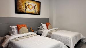 optimized-dormitorio-camas-individuales-apartamento-dolce-arancia